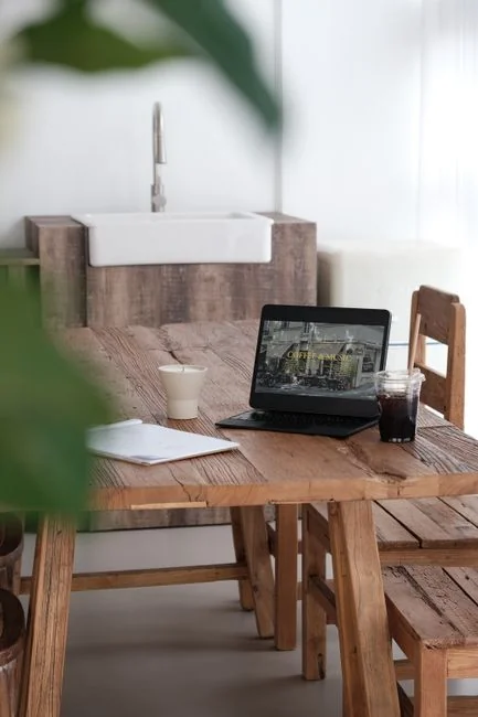 A tablet display showing minimalist decor images that highlight greenery and clean, simple design.